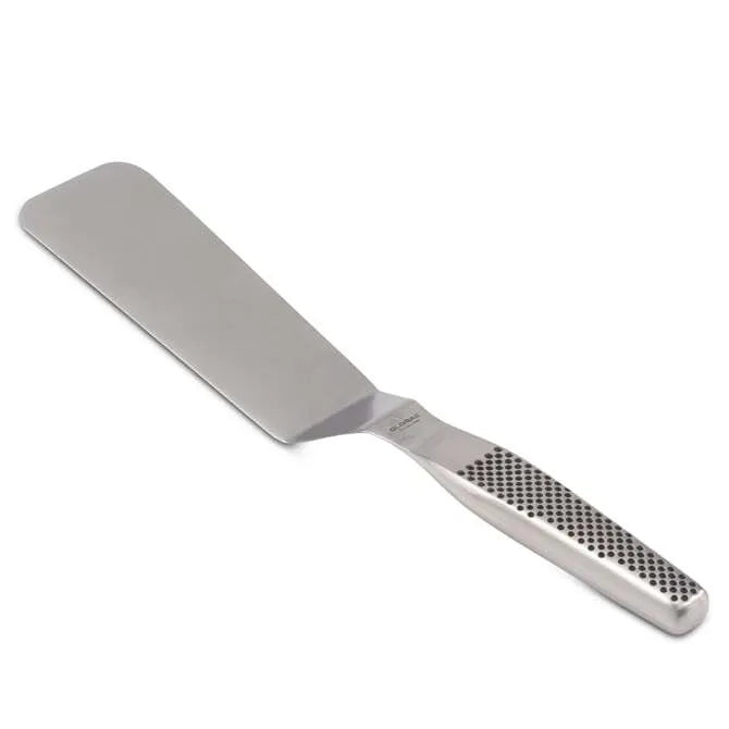 A stainless steel spatula with an offset handle featuring a dimpled grip on white background.