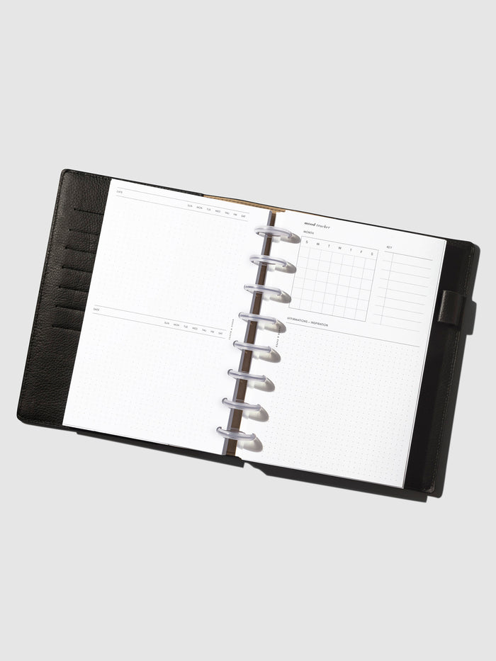 Inserts in use inside a leather folio.