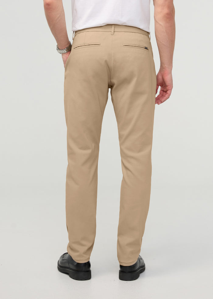 Khaki relaxed taper trouser with back flap pockets, shown from behind on a model wearing a white t-shirt.