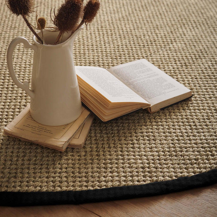 Sisal Rug- 100% Sisal rug with a black border.