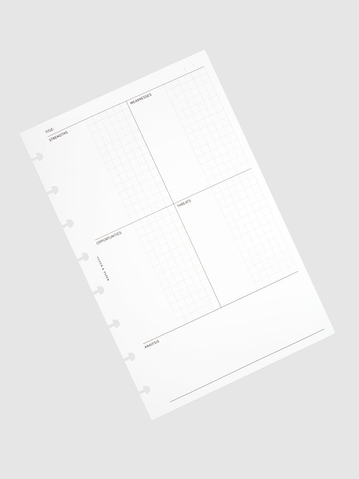 Stack of inserts turned to the left against a neutral background.