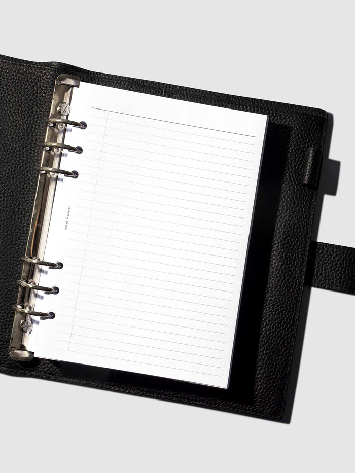 An insert staged inside a leather folio.