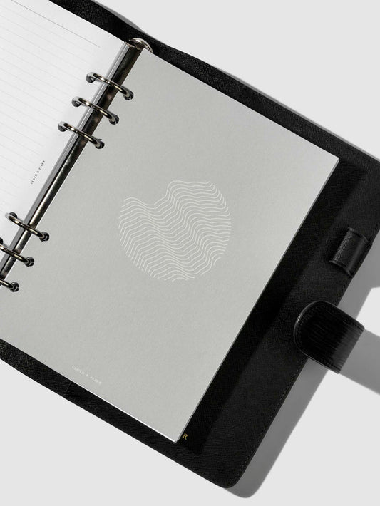Dashboard in use inside a leather agenda.
