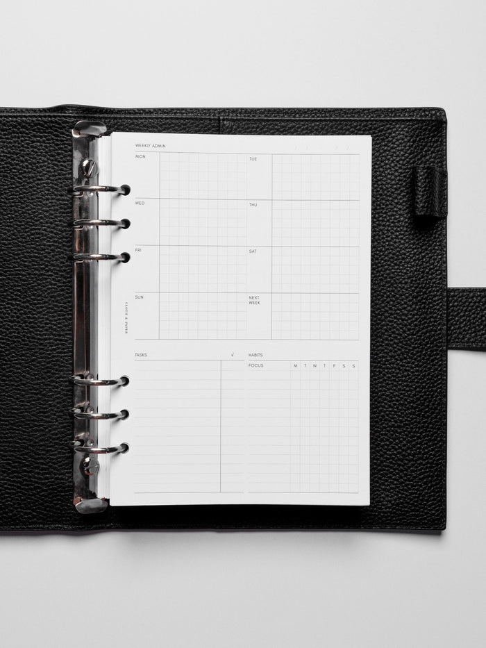 Insert in use inside a black leather planner.